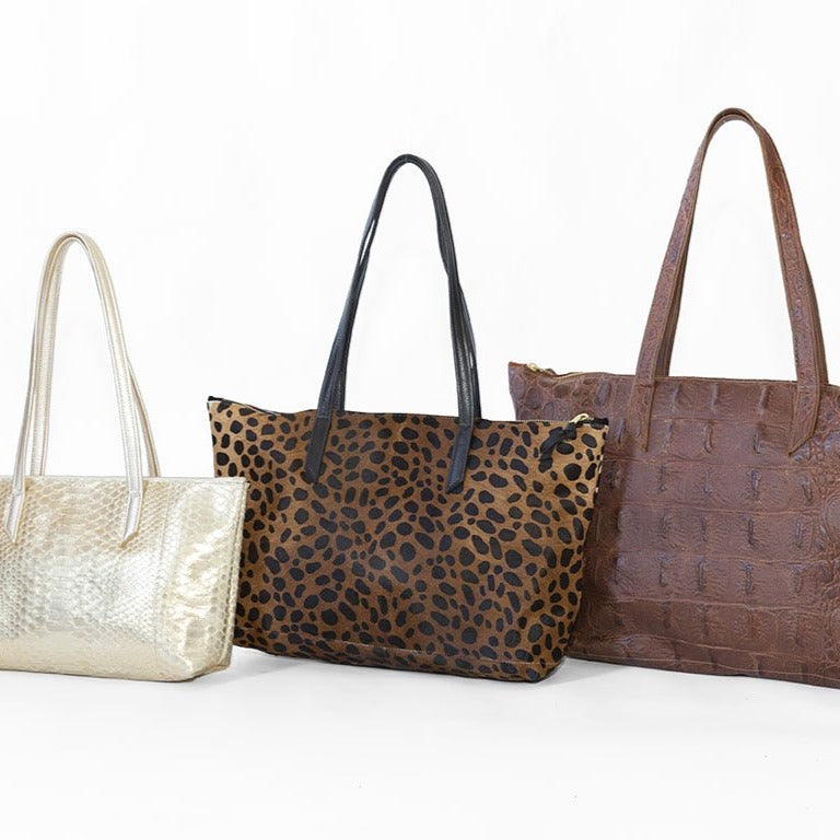 Small in Gold Python, Medium in Brown Cheetah, & Large in Cognac Gator.